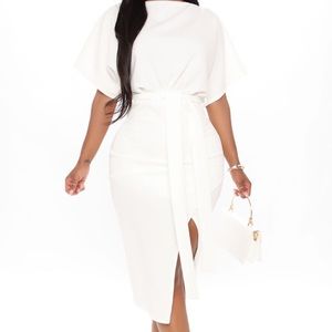 An ivory dress , never worn , the tags are still attached